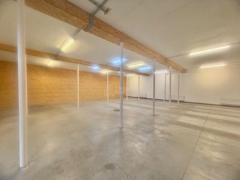 Open-plan commercial spaces with visible beams.