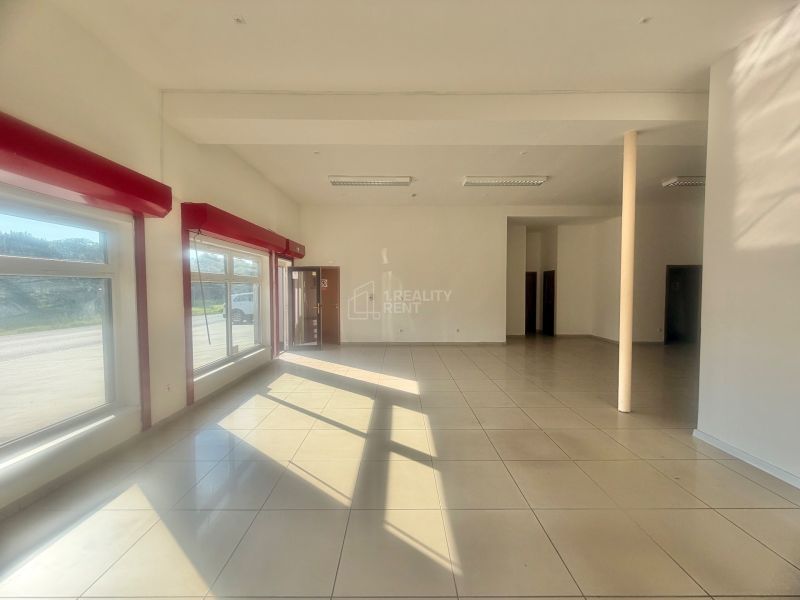 Bright commercial spaces with large windows and tiled flooring.