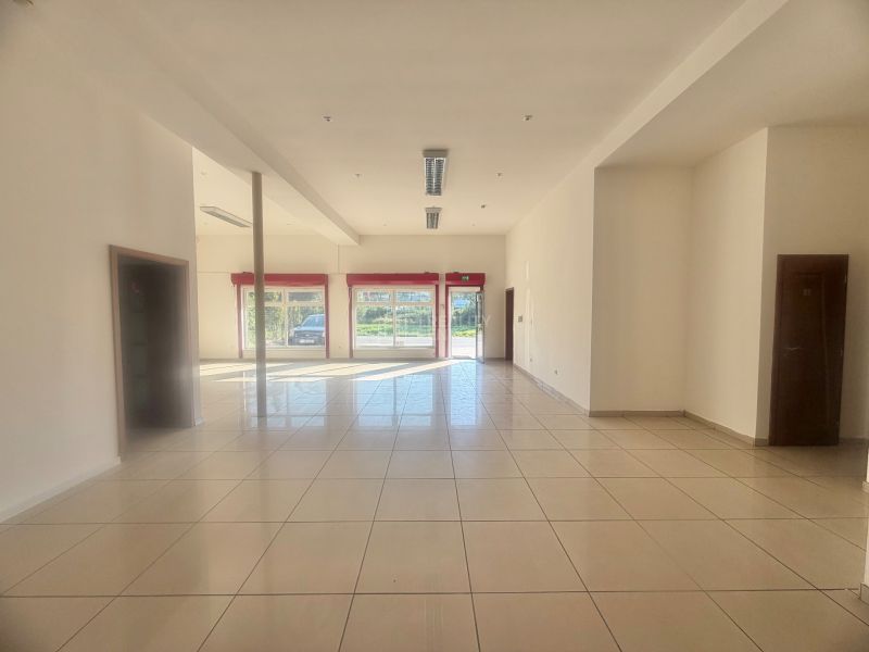 Bright commercial spaces with tiles and large windows provide plenty of natural light.