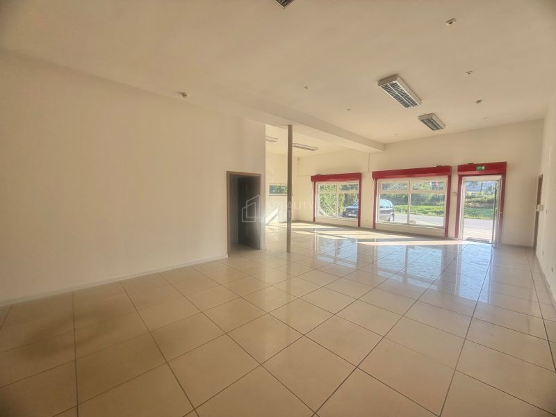 Spacious commercial spaces with large windows and tiling, ideal for business.