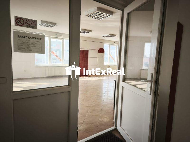 Interior of commercial premises with ceramic flooring and a sign reading 