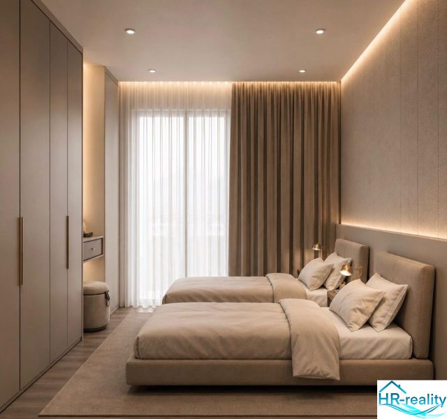 Double bedroom with elegant lighting and wood-patterned flooring in a holiday apartment.