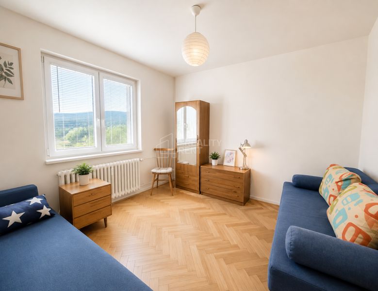 A bright living room with blue sofas and a wood-patterned floor in a 3-room apartment.