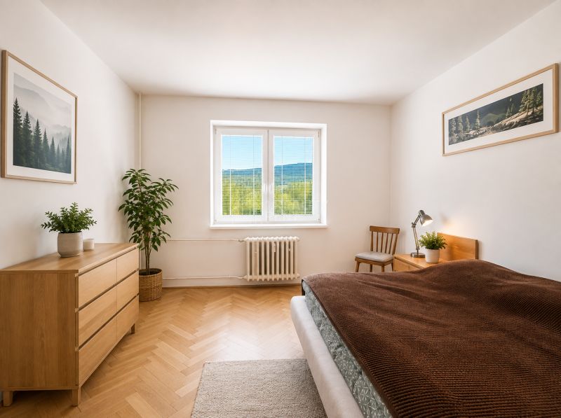 A bright bedroom in a three-room apartment with a wooden decor floor and natural accents.