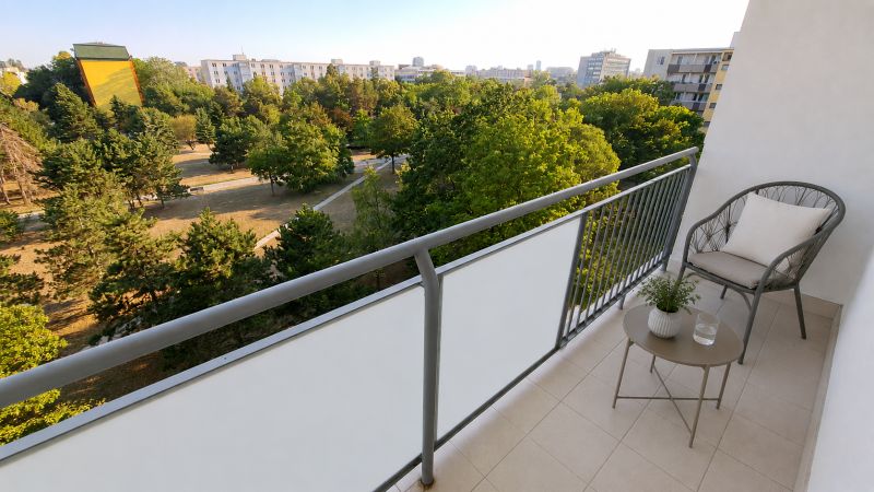 The balcony of a 2-room apartment in Bratislava - Ružinov on Sputniková Street, with a view of greenery.