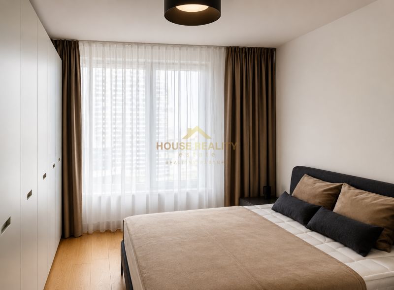 Bedroom with a large bed, built-in wardrobes, and a wooden decor floor in a 3-room apartment.
