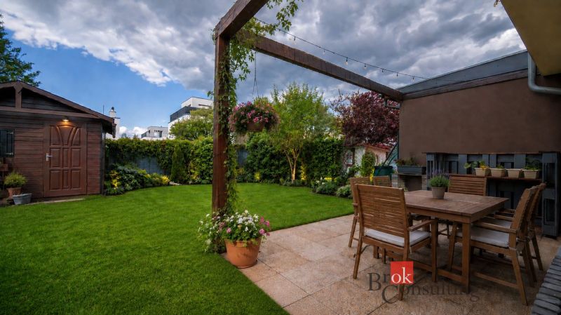 The garden of a family house on Kapsohradská in Bratislava-Záhorská Bystrica with a wooden pergola.