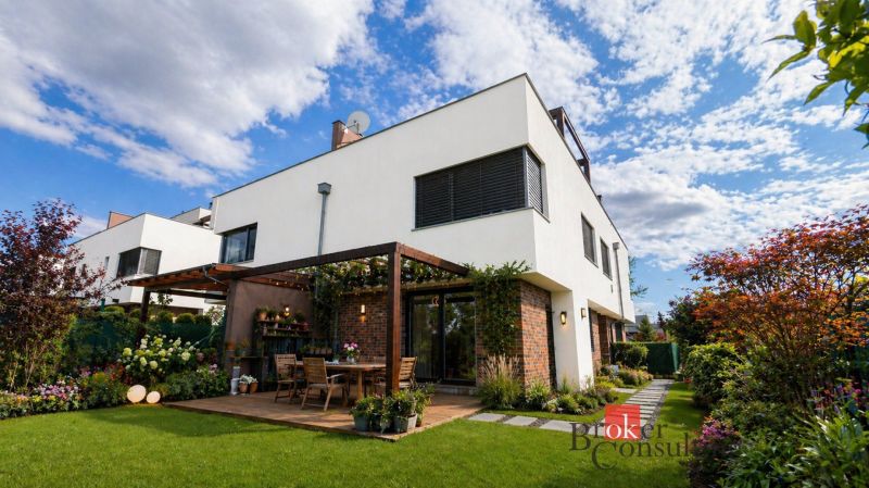 A family house on Kapsohradska Street in Bratislava-Záhorská Bystrica with a terrace and surrounding greenery.
