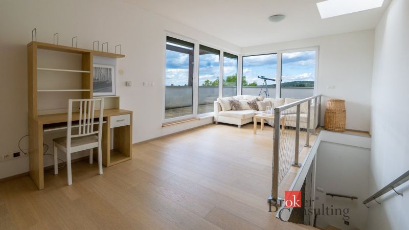 Interior in a family house with a sofa, a writing desk, and a telescope, floor with a wooden decor.
