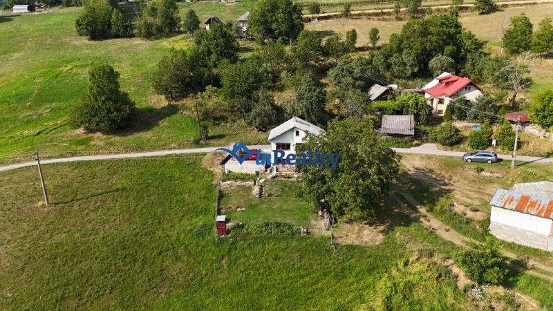 A family house in Hriňová at Pivnička 430 surrounded by greenery and meadows.