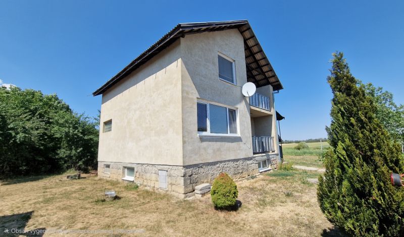 A family house on Biela Street in Kazimír with a large yard and a satellite dish.