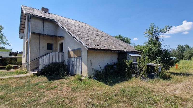 A family house on Biela Street in Kazimír with a simple facade and an overgrown plot.