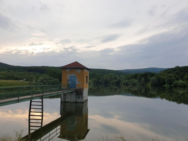 A reservoir amidst agricultural and forest lands in Kučišdorf Valley near Pezinok.
