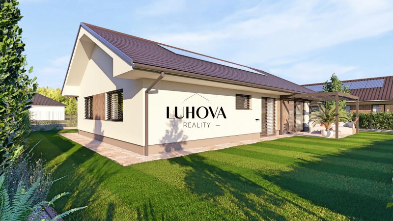 A family house in Tuchyňa surrounded by a green lawn and a garden terrace.