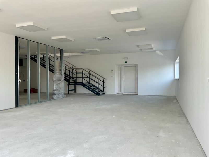 Interior of warehouses and halls with installed lighting and staircase.