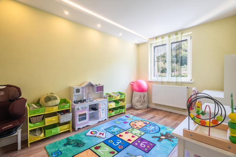 Children's room with toys and a wooden decor floor in a 4-room apartment.