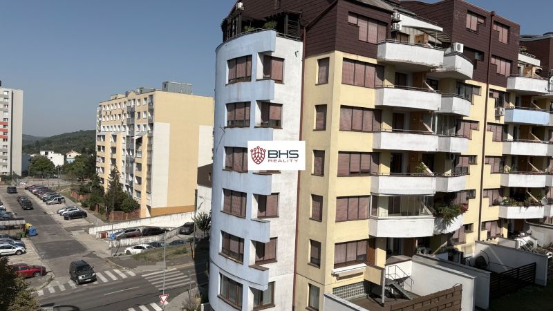 A view of Kresánkova Street in Bratislava - Karlova Ves with residential apartment buildings.
