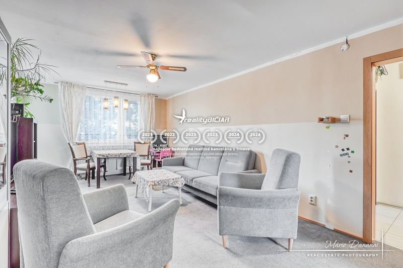 A bright living room in a 4-room apartment with comfortable furniture and decorative details.