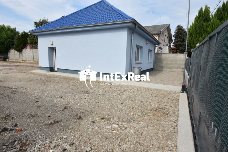 The exterior of commercial premises on Dlhoveská Street in Šaľa with a blue roof.