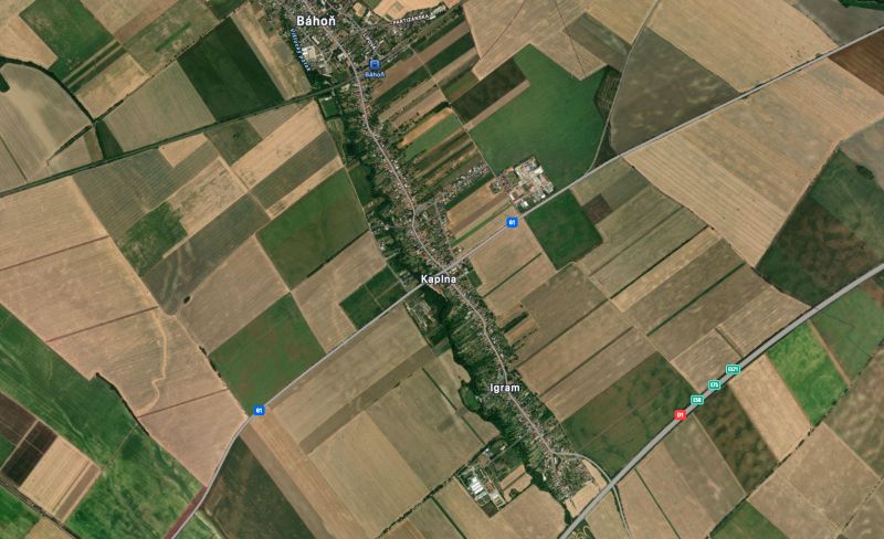 Aerial photograph of agricultural and forest lands near Kaplna, with road communications and surrounding settlements.