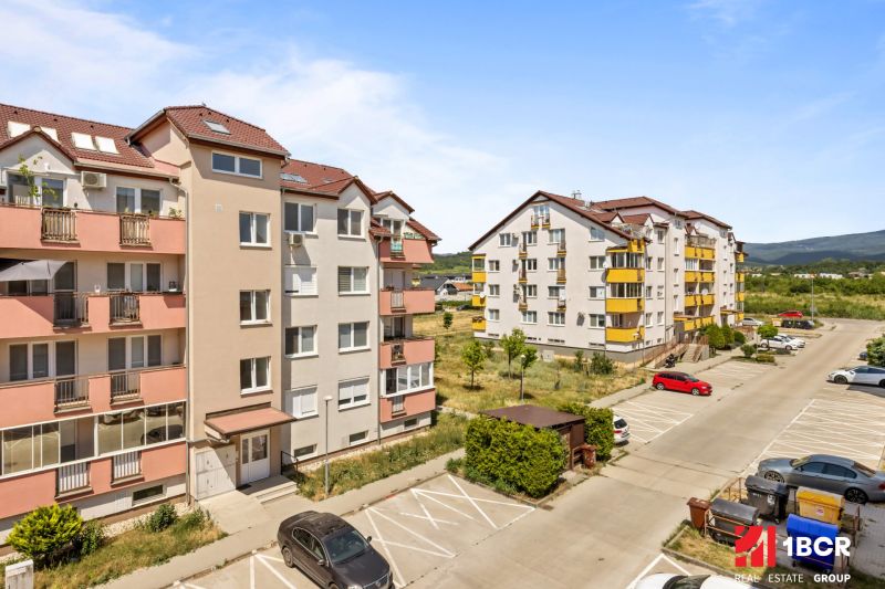 On Dona Sandtner Street in Pezinok, there are apartment buildings with parking spaces in front of the 2-bedroom apartments.
