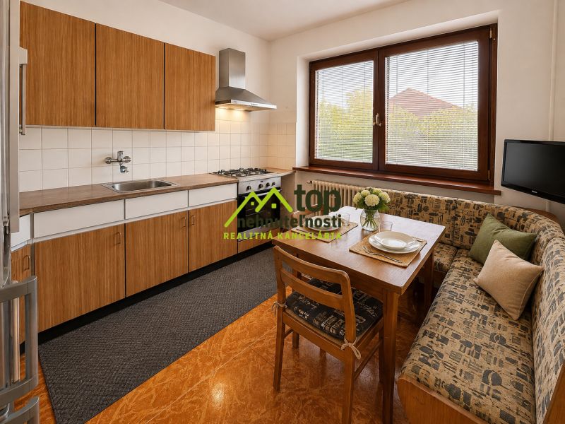 A kitchen in a family house with a wooden decor floor, a dining table, and a corner bench.