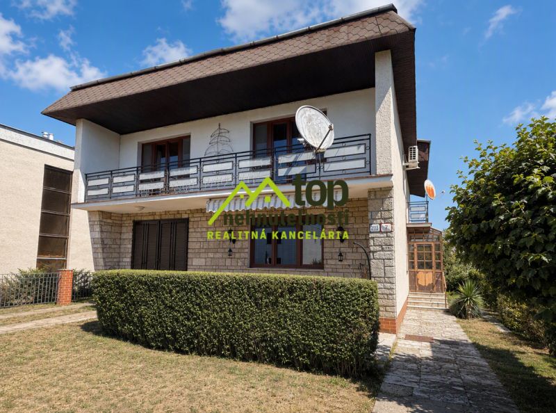 A family house on Ľaliová Street in Topoľčany with a garden and a satellite dish.