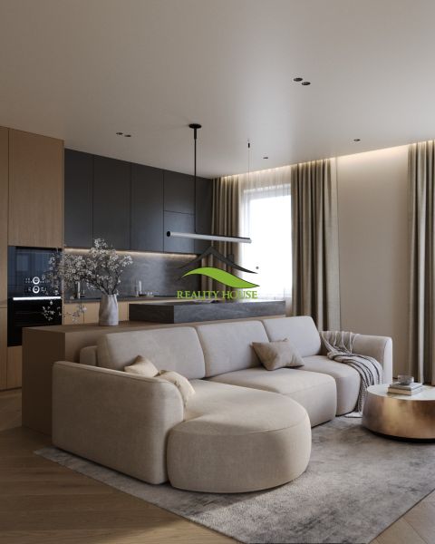 Living room with kitchen in a 3-room apartment, wooden decor flooring, beige sofa.