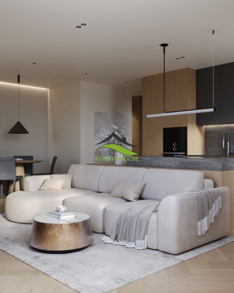 Living room with a comfortable sofa and a wooden decor floor in a 3-room apartment.