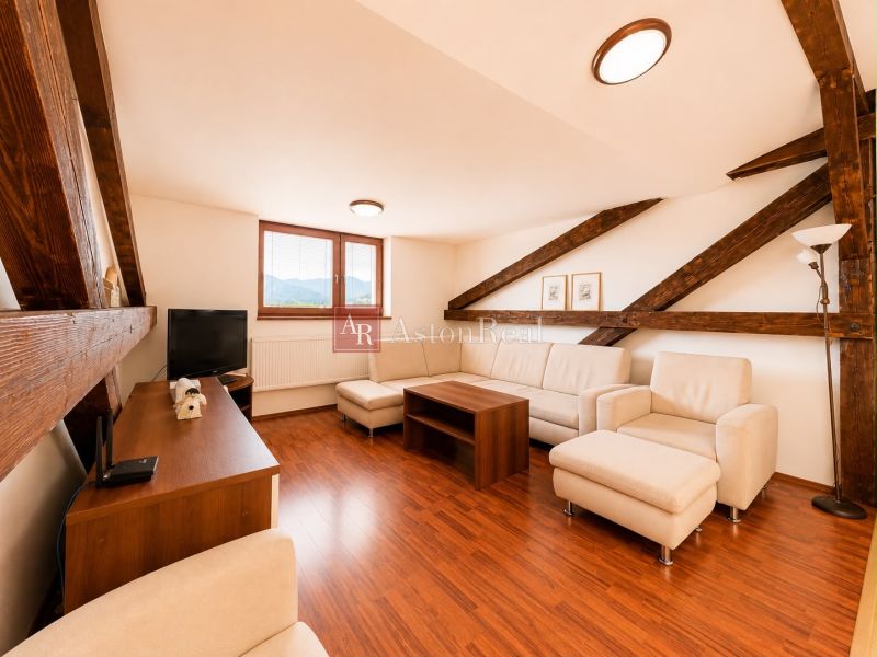 Living room in a 3-room apartment with a wooden decor floor, bright interior.