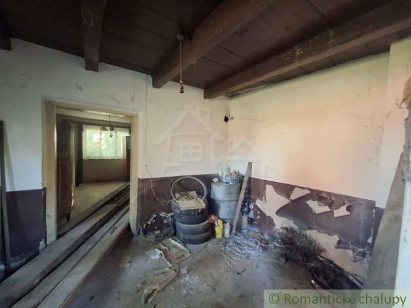 Interior of a family house with white walls and stored building materials.