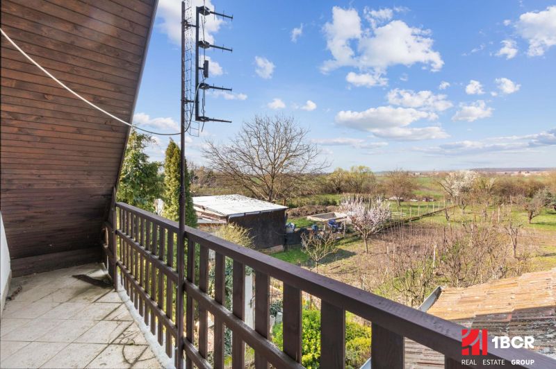 View from the balcony of a family house in Maňa on Legionárska Street, rural landscape.