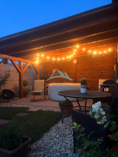 A cozy terrace of a family house in Šahy on Tešmak with lighting and a relaxation corner.