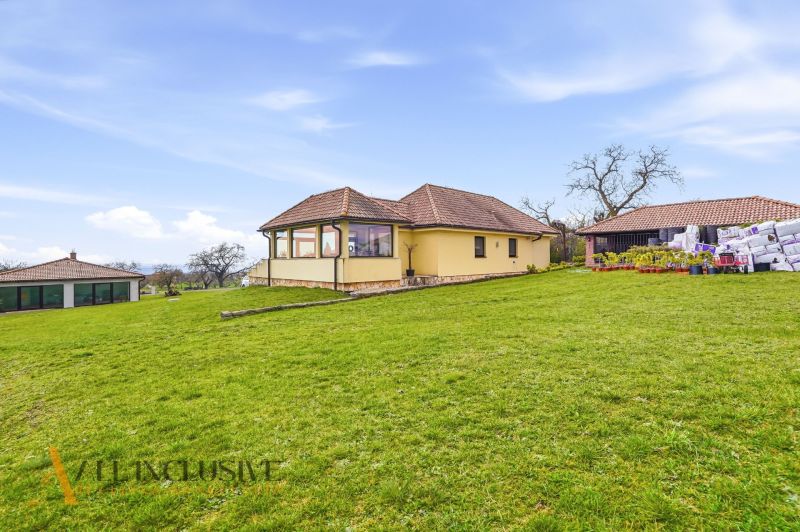A family house in Kopanice in Krupina surrounded by a green lawn and an annex.