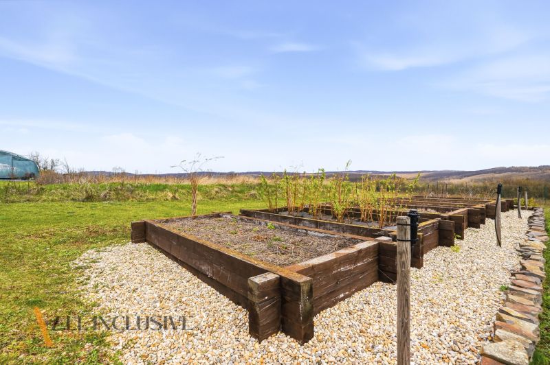 A garden with raised beds around a family house in Kopanice, Krupina.