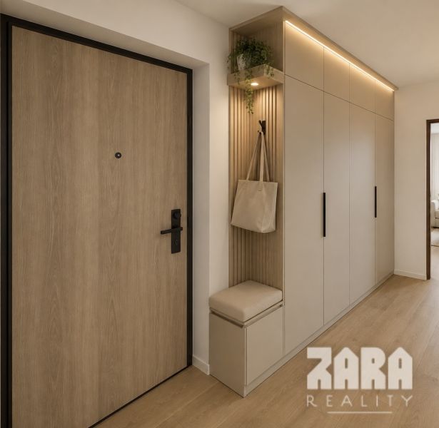 Entrance hallway in a 3-room apartment with a wooden decor floor and built-in wardrobes.