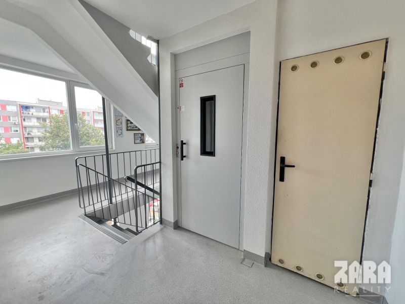Apartment corridor with staircase, elevator, and windows on Družicová in Košice - Nad jazerom district.