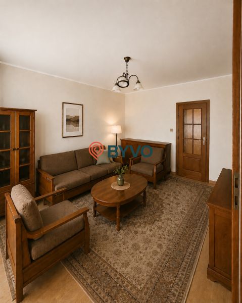 A living room in a three-room apartment with wooden furniture and a carpet.