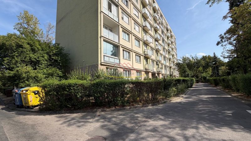 An apartment building surrounded by greenery on Šándorova Street in Bratislava - Ružinov.
