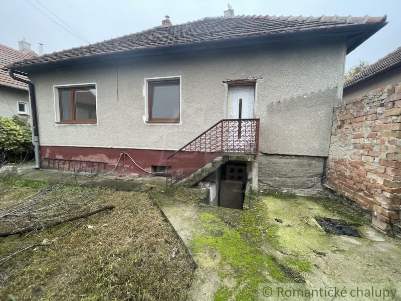 A family house in Šurany with a classic gable roof and a small yard.