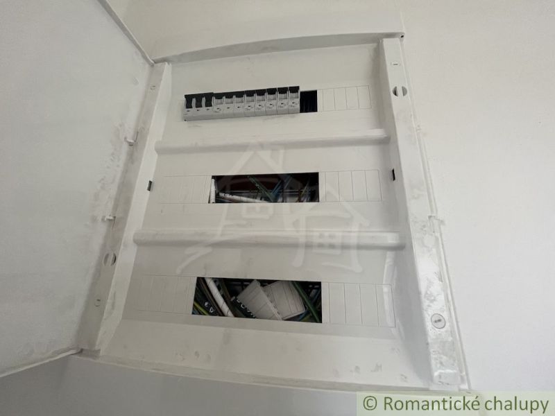 An electrical distribution box in a family house with empty plug-in positions.