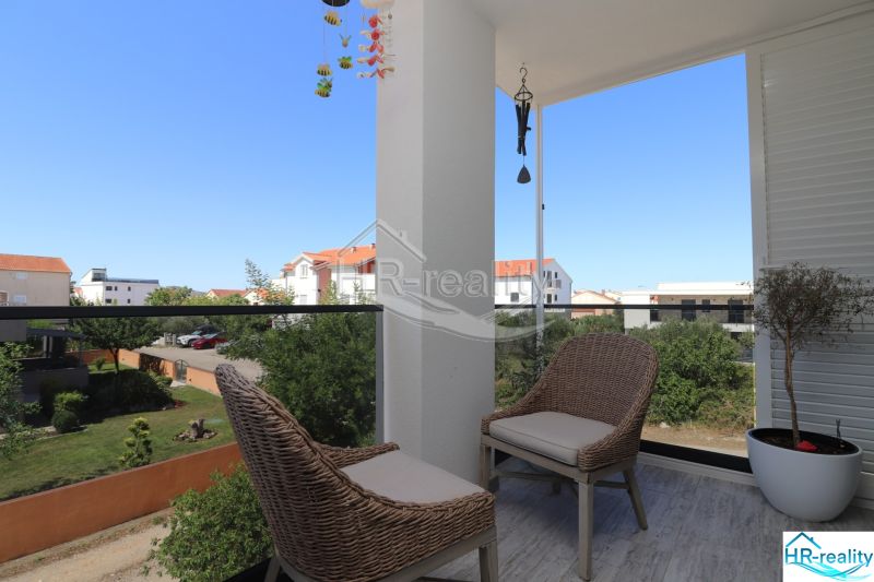 Balcony of the Holiday Apartment in Srima with a view of the surroundings and the garden.