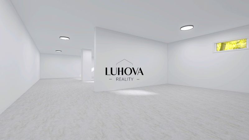 Spacious commercial spaces with white walls and wood-patterned flooring.