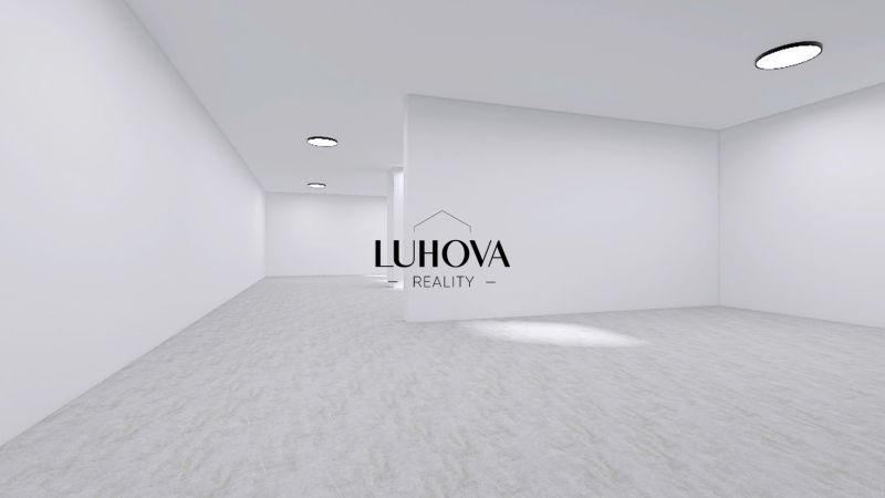 Spacious commercial spaces with white walls and round light fixtures.