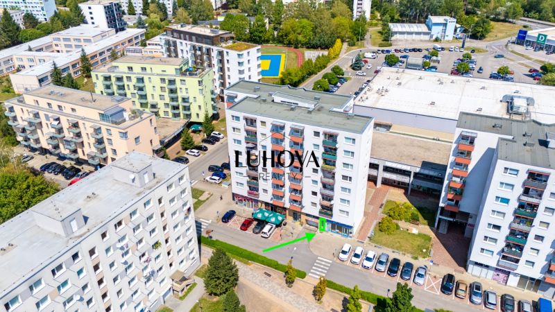 Aerial view of buildings and commercial spaces on Dvory Street in Púchov.
