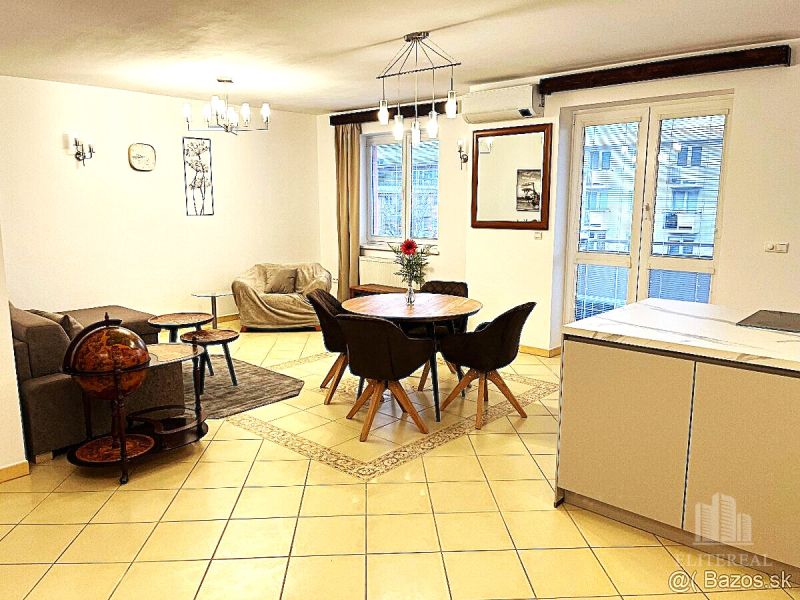 Living room in a 3-room apartment with a dining area and comfortable sofas.