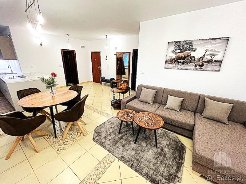 Living room in a 3-room apartment with a dining table and a sofa.