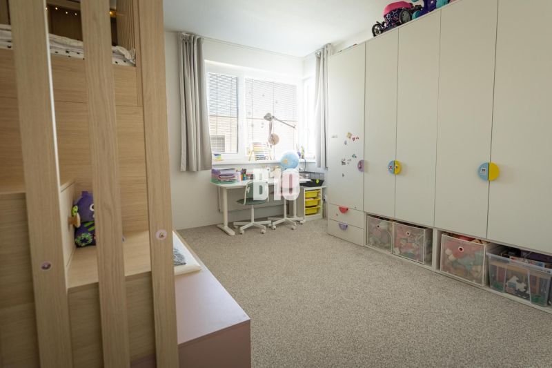 Children's room with a bunk bed and storage space in a 3-room apartment.