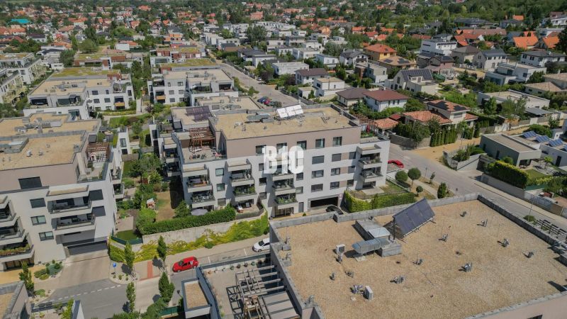 Aerial view of residential buildings in Bratislava IV with surrounding greenery.