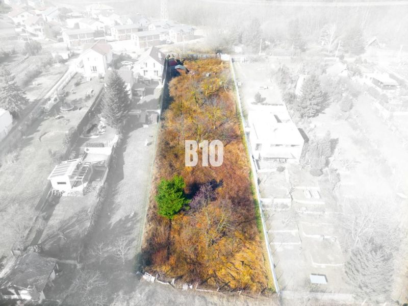 A top-down view of residential plots on Lesná Street in Stupava with surrounding houses.
